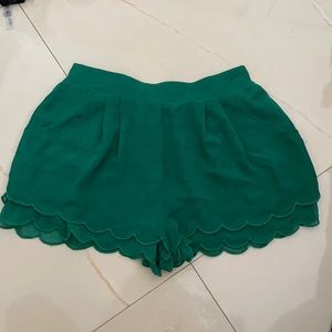 Emerald green shorts with scalloped detail